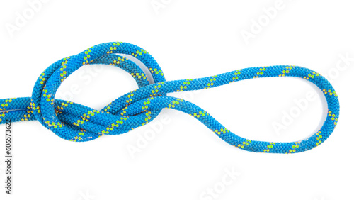 durable colored rope for climbing equipment on a white background. knot of braided cable. item for tourism and travel