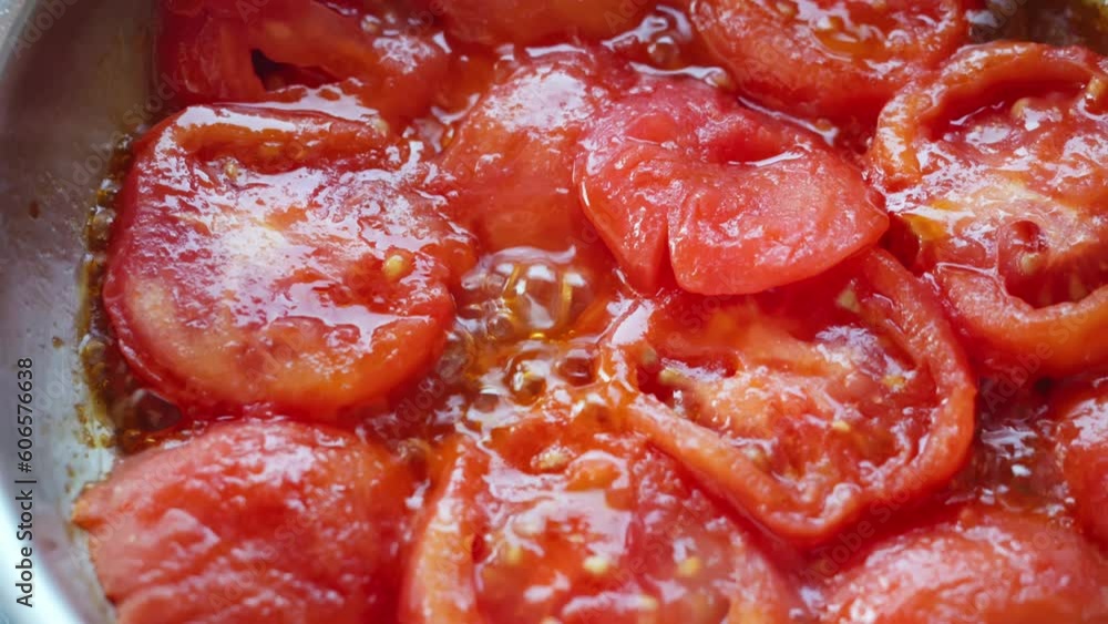 Cooking tomato slice in olive oil Cooking tomato slice in olive oil