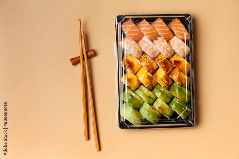 Set of sushi rolls in plastic packages on a light background, top view. Set of sushi rolls in plastic packages on a light background, top view.