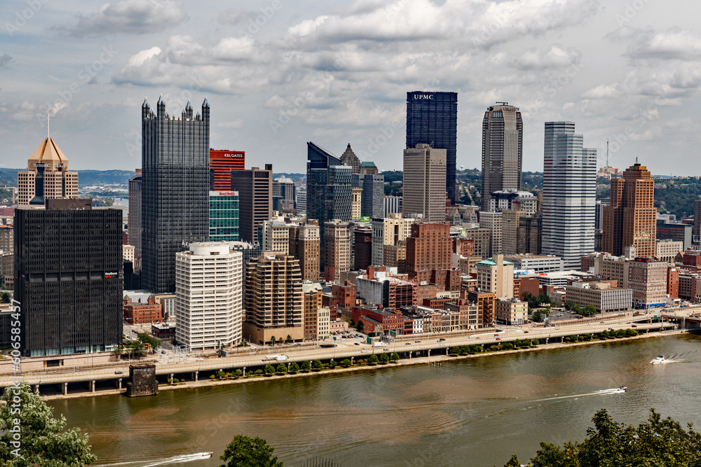 Downtown Pittsburgh skyline on a high contrast, mostly cloudy day.