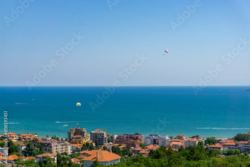 View of some people parasailing near the city of Burgas, Bulgaria in the summer.