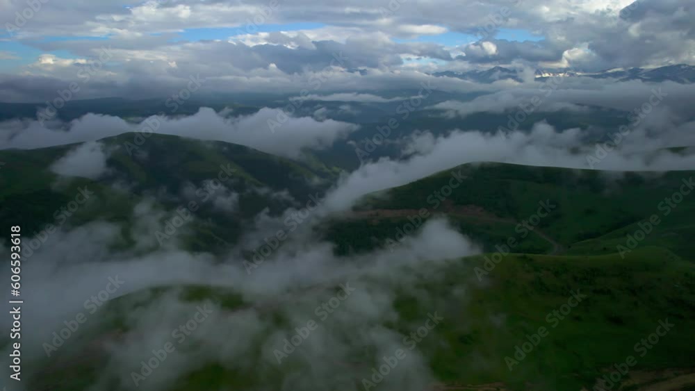 Low clouds in the mountains. Aerial view of low fog in mountainous area Low clouds in the mountains. Aerial view of low fog in mountainous area