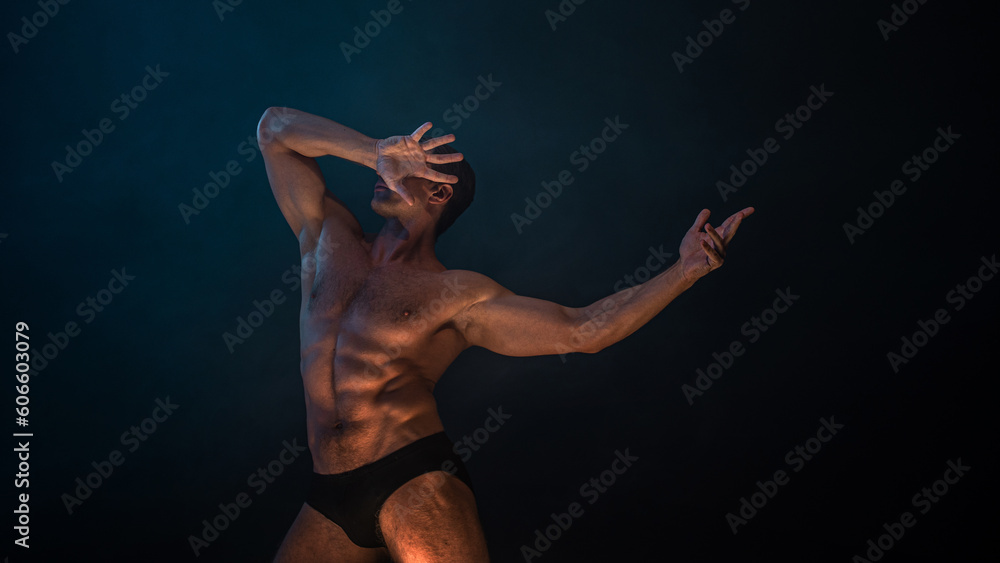 A muscular athlete in an epic pose, fog and smoke on the background, warm mystical light from below, the concept of the antique beauty of the human body