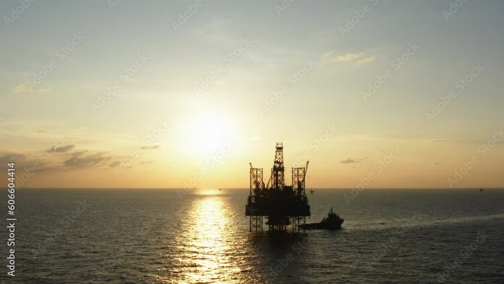 Aerial view of silhouette offshore jack up drilling rig during sunset - oil and gas industry
Aerial view of silhouette offshore jack up drilling rig during sunset - oil and gas industry