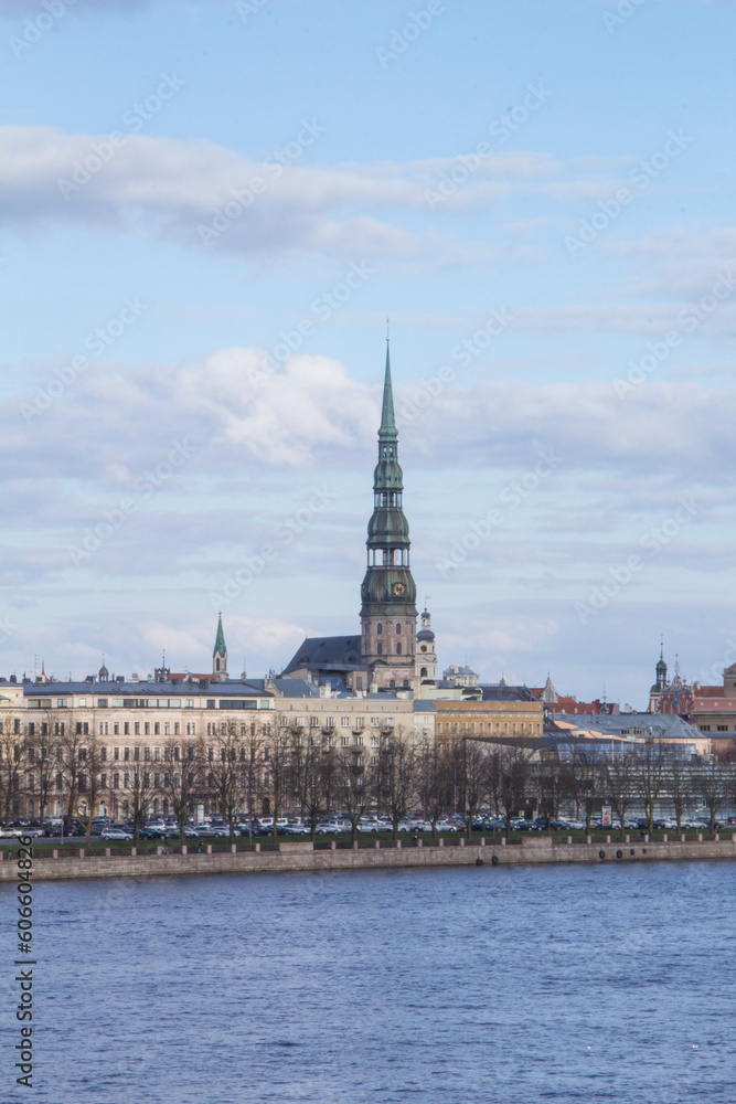 Beautiful view of St. Peter's Cathedral across the Daugava River in Riga, Latvia
