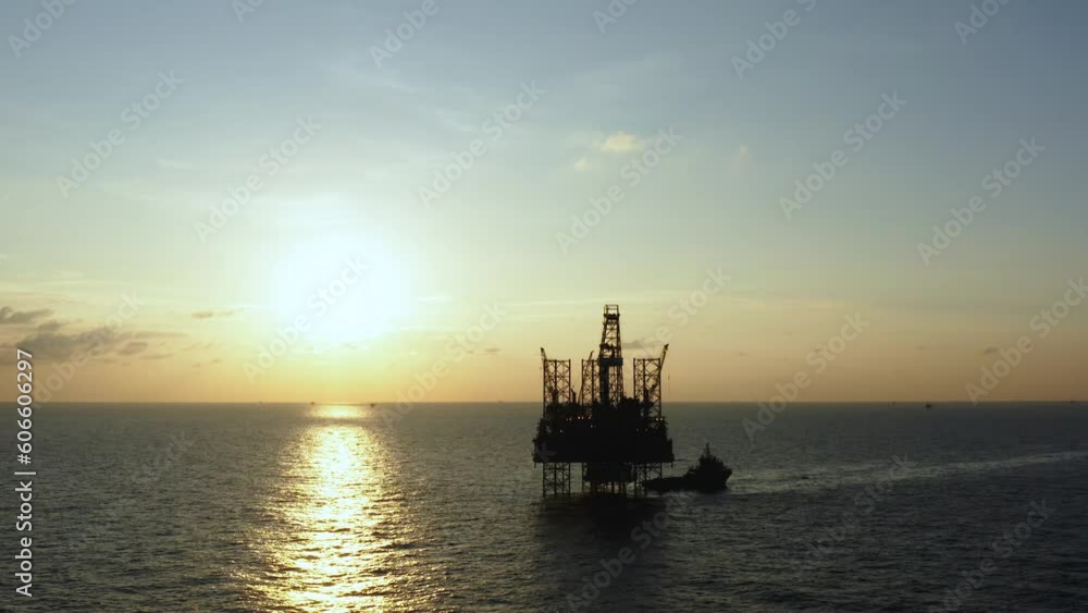 Aerial view of silhouette offshore jack up drilling rig during sunset - oil and gas industry
Aerial view of silhouette offshore jack up drilling rig during sunset - oil and gas industry