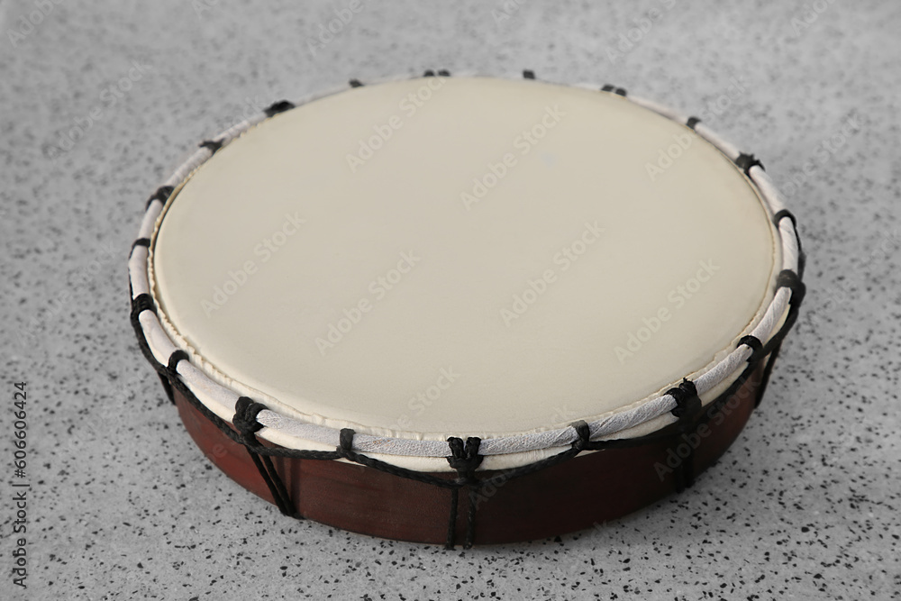 Drum on grey table, closeup. Percussion musical instrument Drum on grey table, closeup. Percussion musical instrument