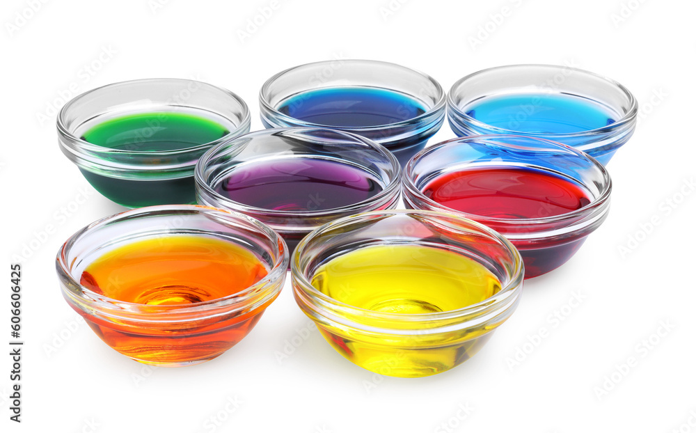 Glass bowls with different food coloring on white background Glass bowls with different food coloring on white background