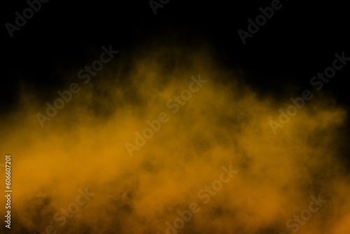 Orange powder explosion on black background. Colored powder cloud. Colorful dust explode.Orange powder explosion on black background. Colored powder cloud. Colorful dust explode.