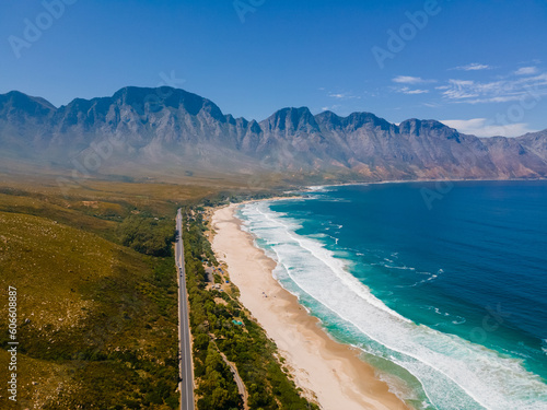 Kogelbay Beach Western Cape South Africa, Kogelbay Rugged Coast Line with spectacular mountains. Garden route. Drone aerial view at a road in the mountains next to the ocean photo