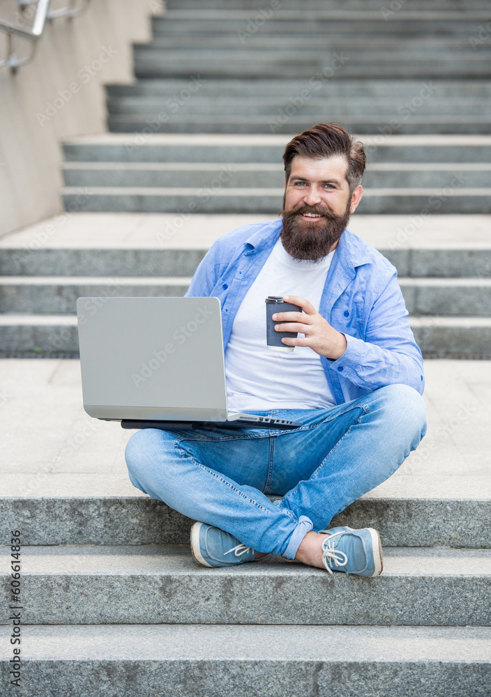 cheerful man freelancer has video call on laptop. man freelancer has video call outside. cheerful man freelancer has video call on laptop. man freelancer has video call outside.