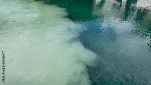 River confluence in Switzerland, Geneva, between the Rhone and the Arve. Clear glacier river confluence in Switzerland 2023.  