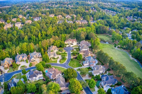 Aerial panoramic view of an upscale subdivision shot during golden hour photo