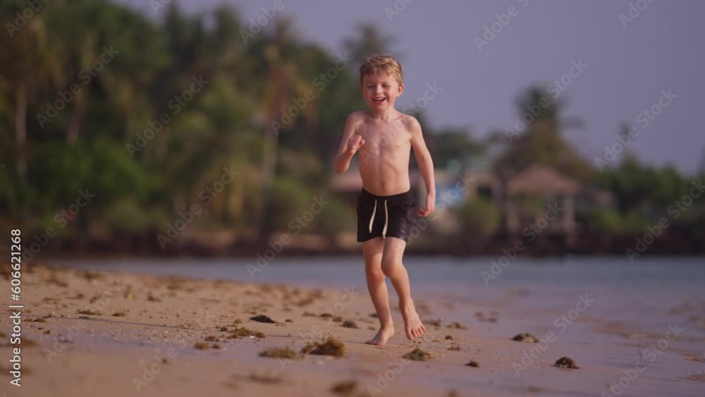 Boy Happily Running On Thailand's Beach Boy Happily Running On Thailand's Beach