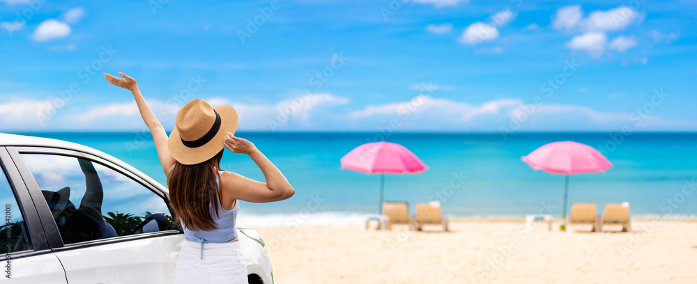 Young woman traveler looking at the beautiful beach and sea view with her car while travel driving road trip on summer vacation, Banner panorama