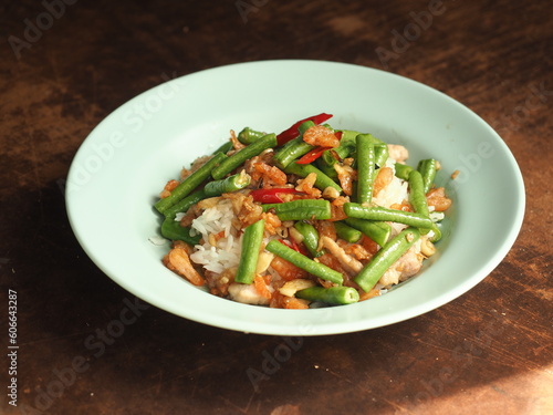 stir fried long bean with garlic, chili and dried shrimp on top of steamed rice