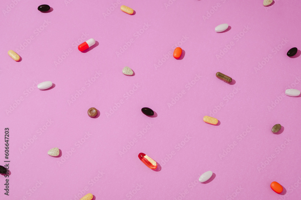 Vitamins And Supplements On A Pink Background Vitamins And Supplements On A Pink Background