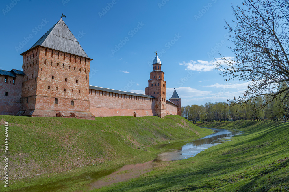 At the walls of the ancient Kremlin of Veliky Novgorod on a sunny April day. Russia