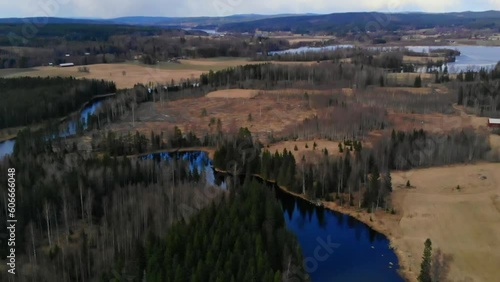 Drone shot of river, lake, fields and nature in Sweden at fall. photo