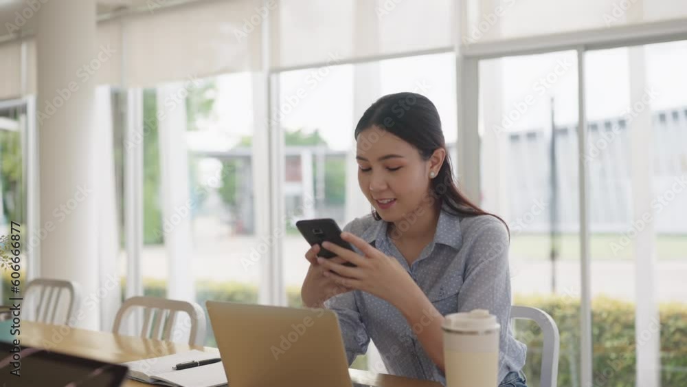 Adult female worker asia people happy smile sit easy relax work hybrid at share office enjoy play typing chat look at mobile phone buy or paying SME retail loan, post read news review app AI chatbot. Adult female worker asia people happy smile sit easy relax work hybrid at share office enjoy play typing chat look at mobile phone buy or paying SME retail loan, post read news review app AI chatbot.