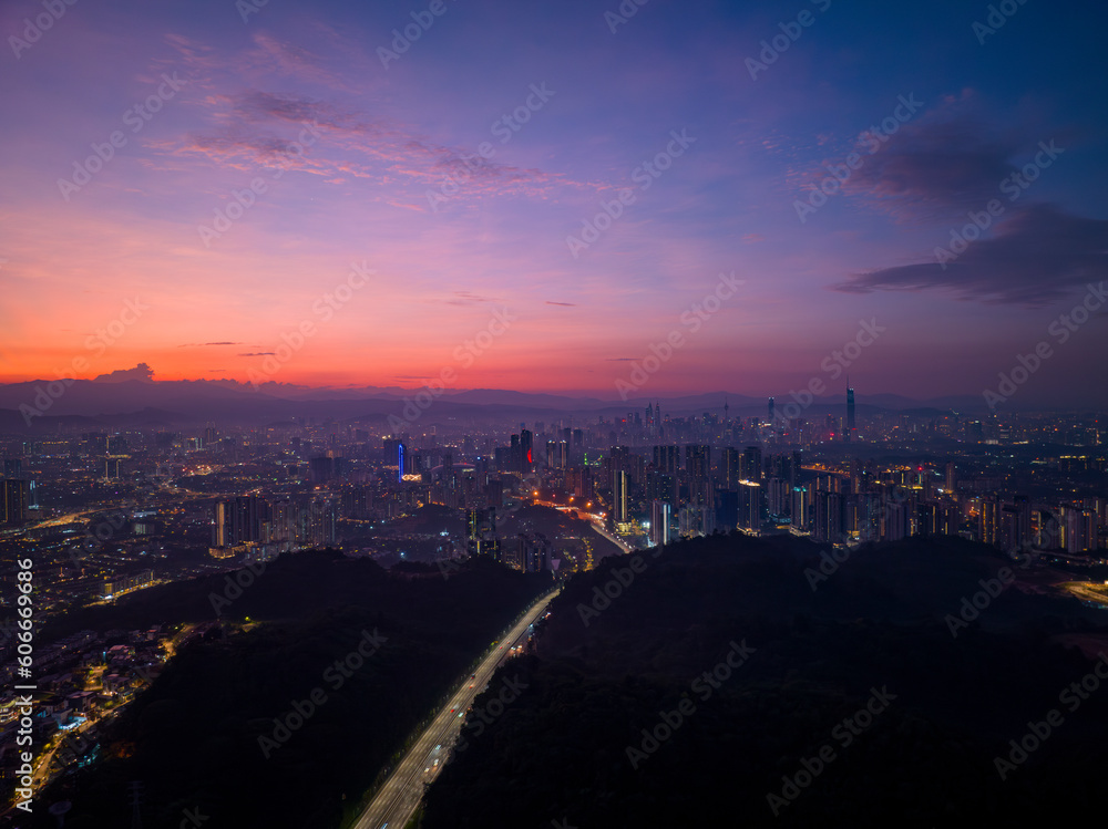 Kuala Lumpur aerial city view during bluehour sunrise overlooking the city skyline with beautiful burning skies in Malaysia.