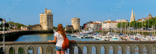 Slika na platnu Woman tourist visiting La Rochelle city- Charente Maritime in France