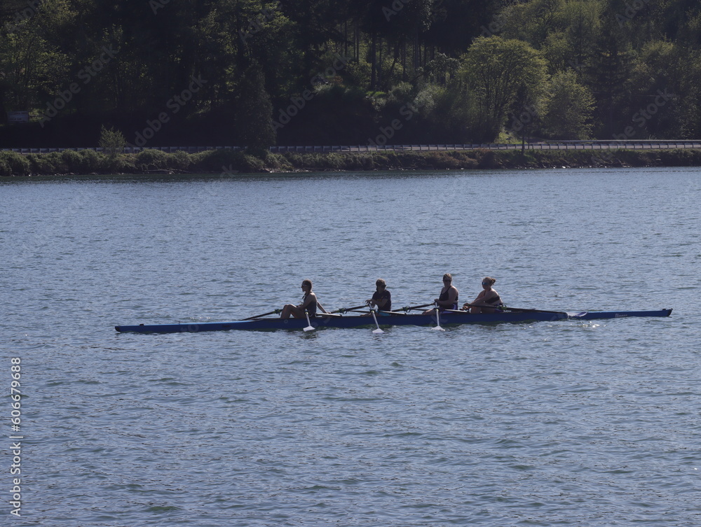 Four women rowing on Dexter Lake