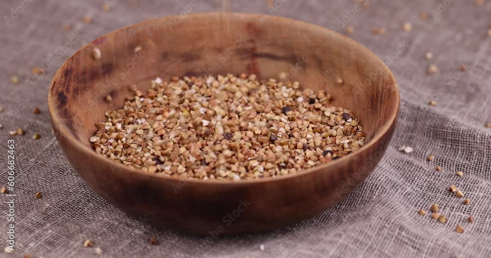 Poorly cleaned buckwheat groats for cooking porridge, a large amount of low-quality processing of buckwheat groats close-up Poorly cleaned buckwheat groats for cooking porridge, a large amount of low-quality processing of buckwheat groats close-up