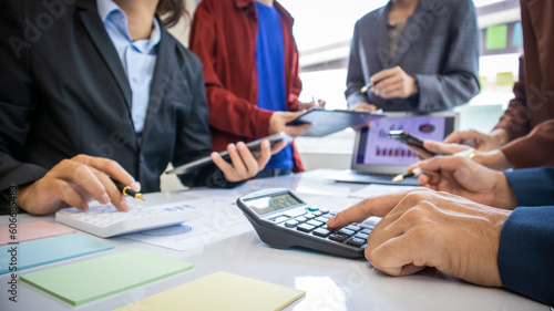 Concentrated african american woman doing paperwork, sitting in modern office on conference. Focused business lady learning financial graphs, working on corporate project at briefing meeting