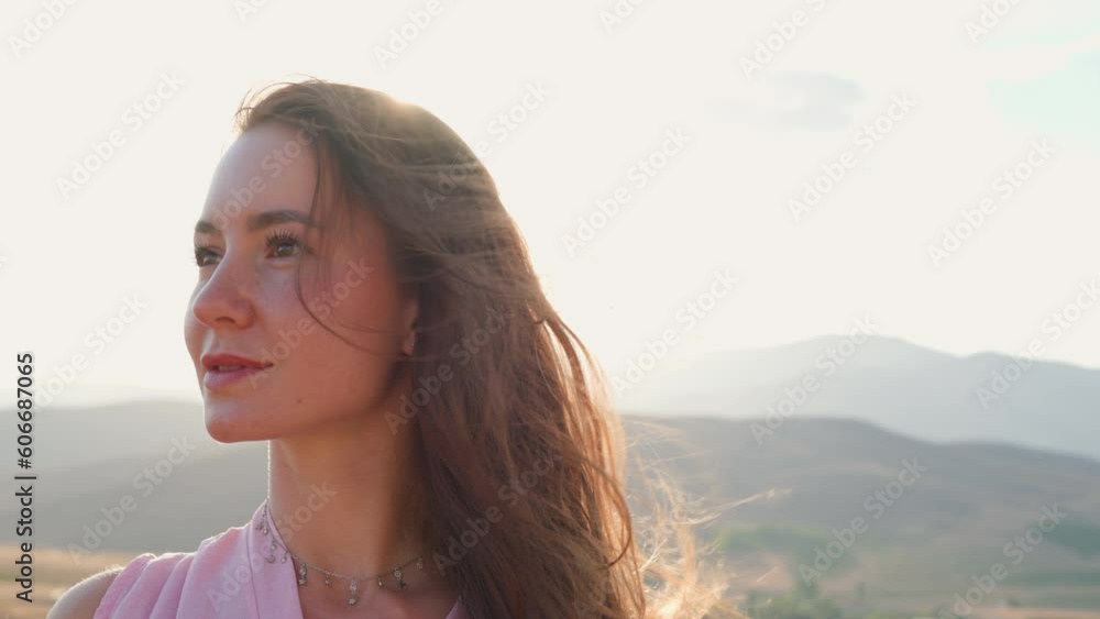 portrait of a young girl in the street. young girl with long hair looks at the camera. close-up. portrait of a young girl in the street. young girl with long hair looks at the camera. close-up.
