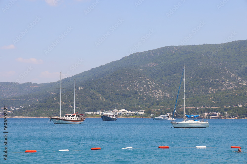 Bodrum, Turkey, May 2023, white yachts on the background of the blue sea, Aegean Sea.