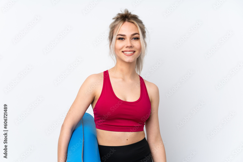 Teenager girl holding waffles over isolated blue background with a mat and smiling Teenager girl holding waffles over isolated blue background with a mat and smiling
