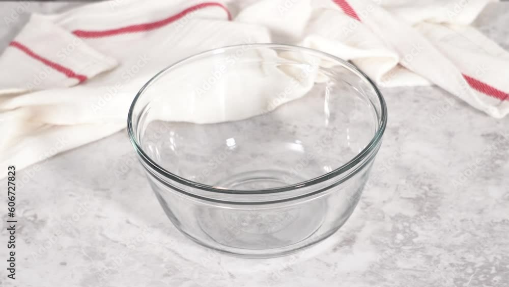 Step by step. Mixing ingredients in a glass mixing bowl to prepare chocolate mug cakes. Step by step. Mixing ingredients in a glass mixing bowl to prepare chocolate mug cakes.