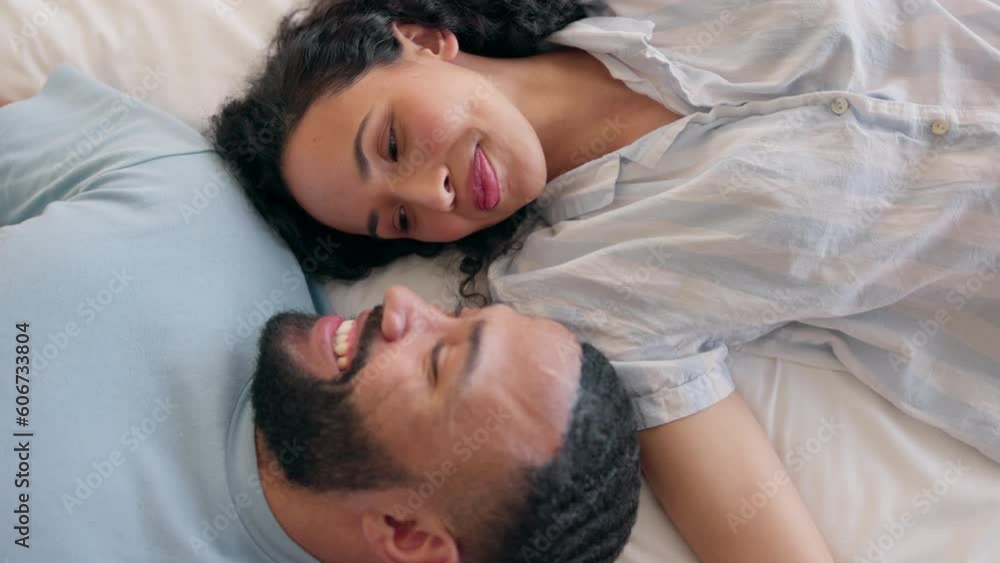 Love, happy couple and relax in a bed from above, smile and sharing romantic morning in their home. Resting, conversation and top view of man with woman in a bedroom waking up, talking and bonding Love, happy couple and relax in a bed from above, smile and sharing romantic morning in their home. Resting, conversation and top view of man with woman in a bedroom waking up, talking and bonding