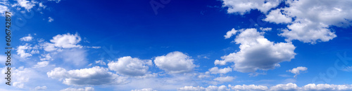 Blue sky background with white clouds. Panoramic image