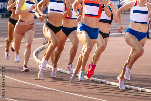 group women runners athletes running 800 metres in summer athletics championships photo