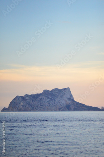 Landscape of the sea and in the background a mountain at sunset