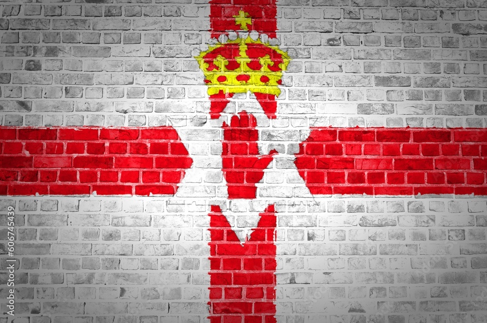 Φωτογραφία Shot of the Northern Ireland flag painted on a brick wall in an urban location