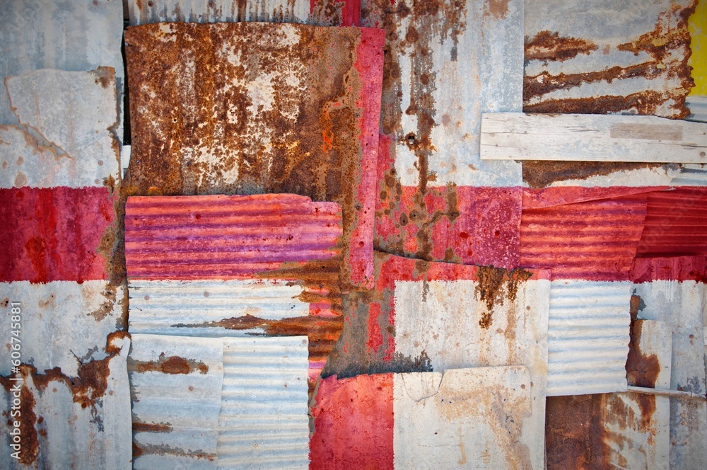 Naklejka premium Abstract background of the flag of England painted on rusty corrugated iron sheets