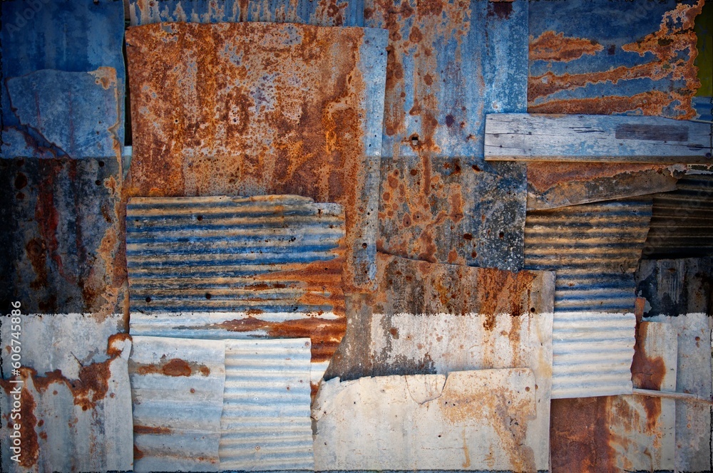 Abstract background of the flag of Estonia painted on rusty corrugated iron sheets