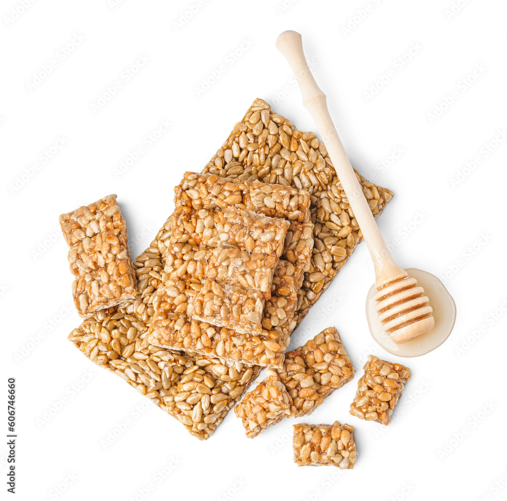 Φωτογραφία Honey with tasty kozinaki of sunflower seeds on white background