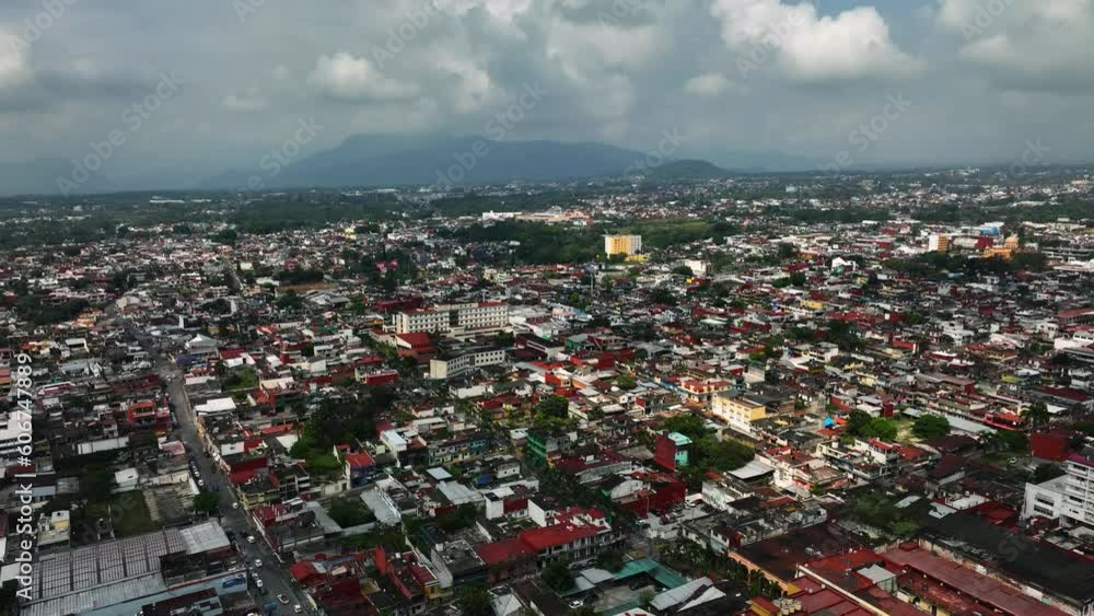 Aerial view overlooking the cityscape of sunlit Cordoba, Veracruz, Mexico - descending, drone shot Aerial view overlooking the cityscape of sunlit Cordoba, Veracruz, Mexico - descending, drone shot
