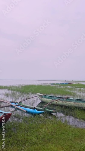 Foggy beach with boats photo