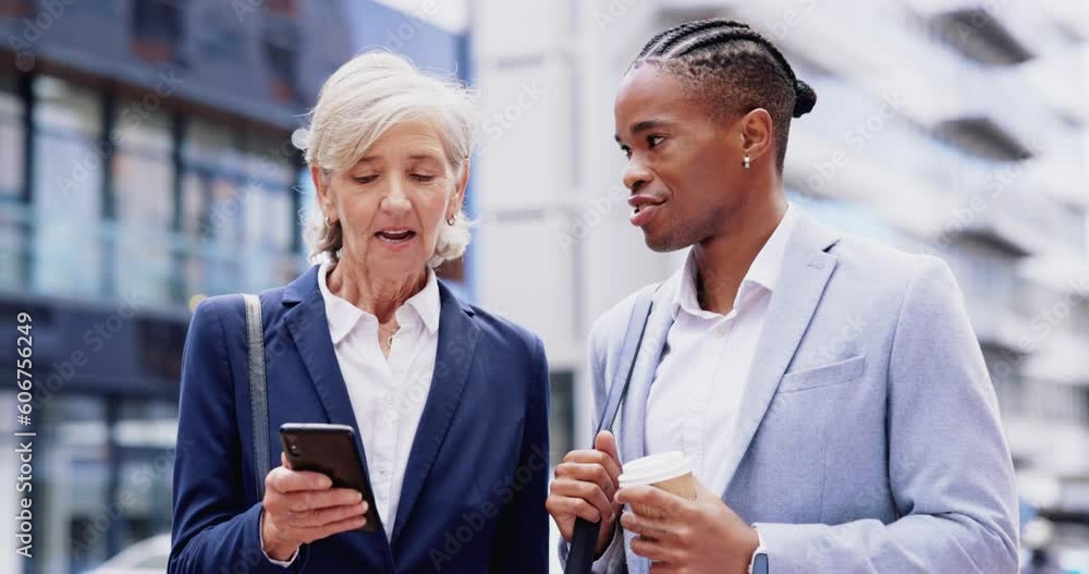 Phone, communication or business people in city talking, discussion and chatting on commute. Travel, networking and man and senior woman on smartphone for diversity planning, social media or internet Phone, communication or business people in city talking, discussion and chatting on commute. Travel, networking and man and senior woman on smartphone for diversity planning, social media or internet