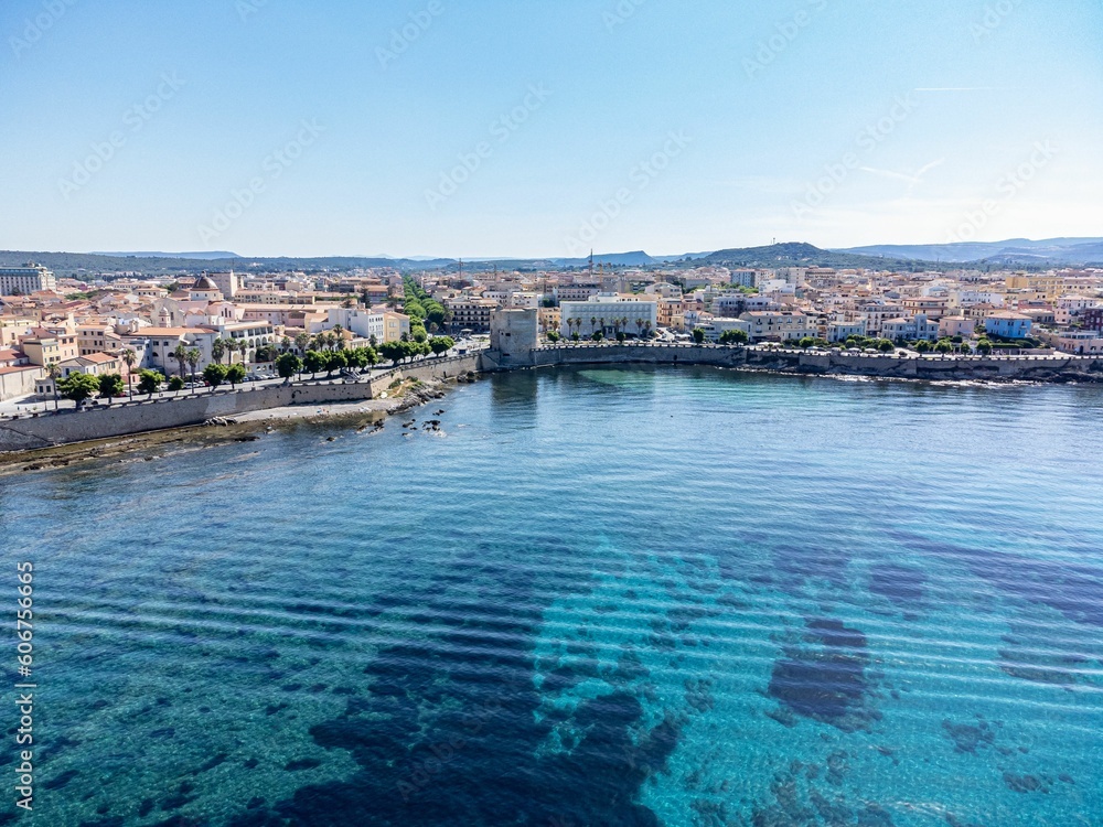 Aerial view of the beautiful blue water near the coast of Alghero, Sardinia, Italy