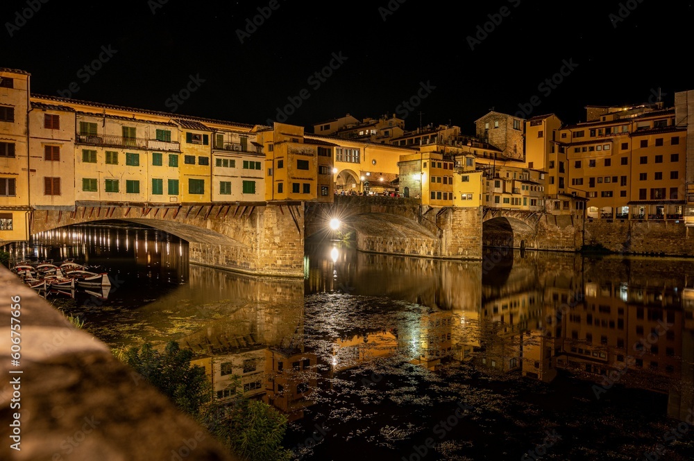 Beautiful view of the Old Bridge (Ponte Vecchio) over the Arno River in Florence, Italy at night