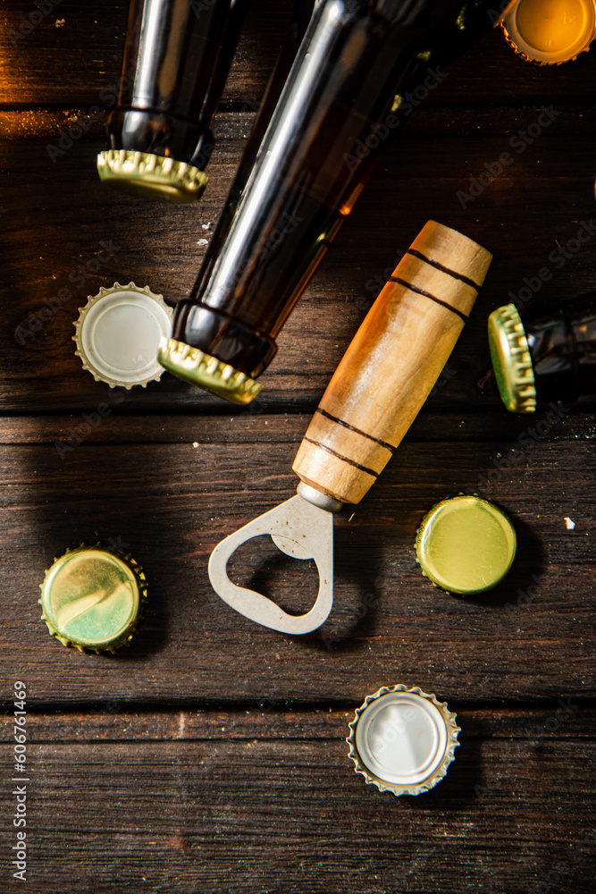 Fotografie Bottles with beer and opener.