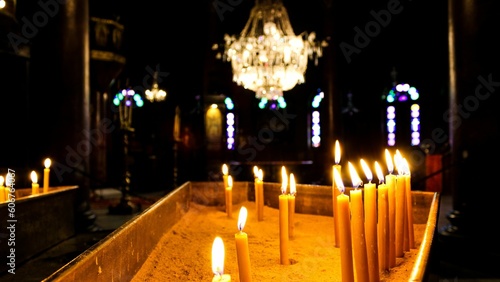 Selective focus shot of Candles in a Coptic church, Cairo, Egypt photo