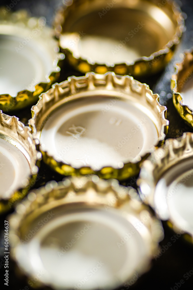 Several beer bottle caps. Several beer bottle caps.