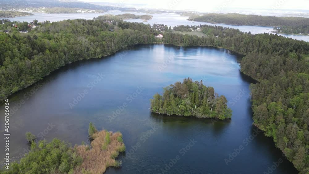 Drone view over the Nesoytjernet lake surface in Nesoya, Norway Drone view over the Nesoytjernet lake surface in Nesoya, Norway
